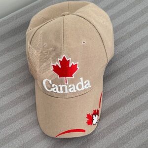 Tan Cap Featuring A Red Maple Leaf and “Canada”  🇨🇦 Embroidery / Adjustable.